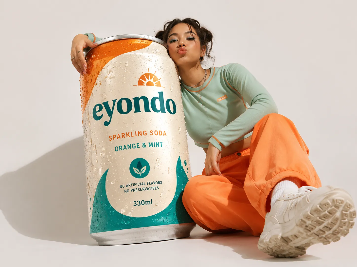 Photorealistic studio shot of a model posing with a branded soda can, generated with GPT Image 2